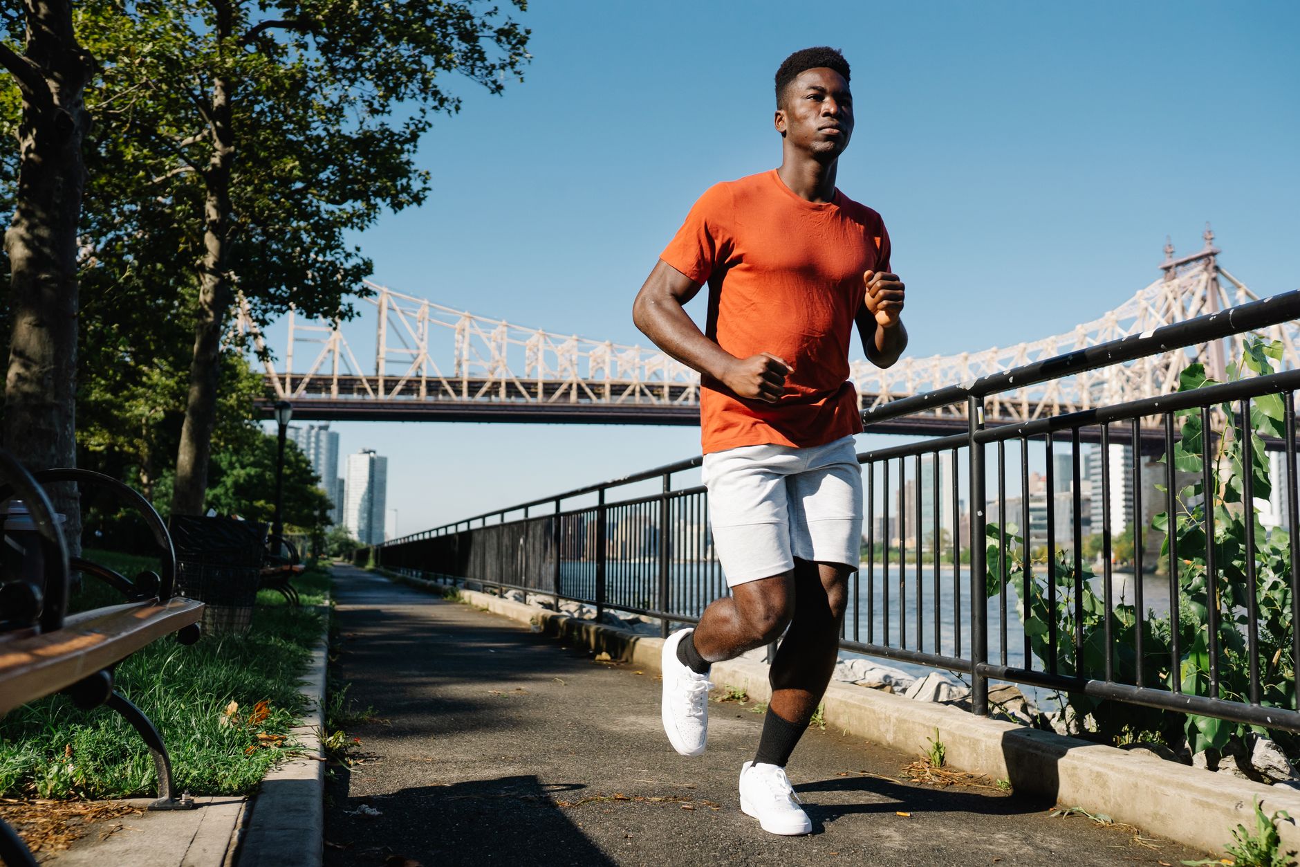 man in orange crew neck t shirt running