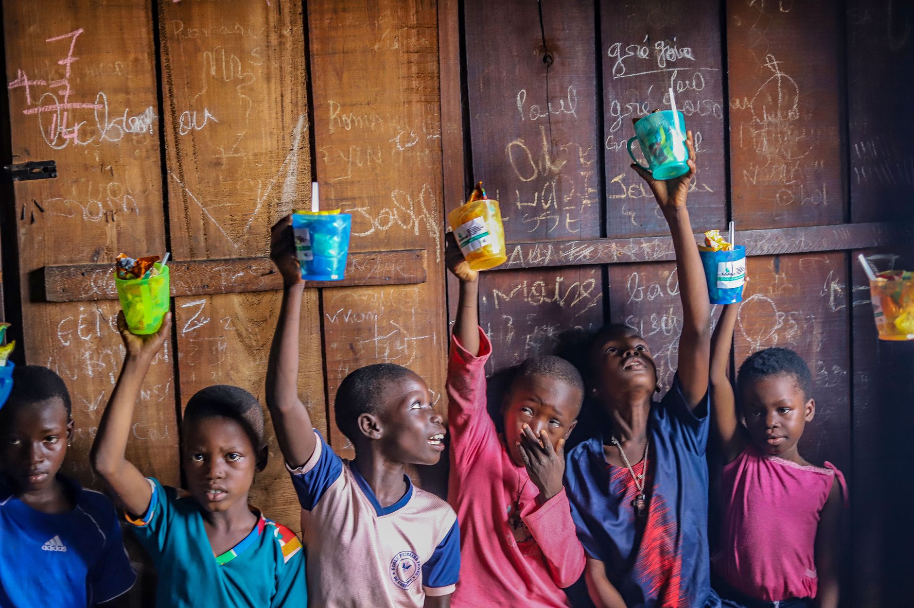 children holding cups